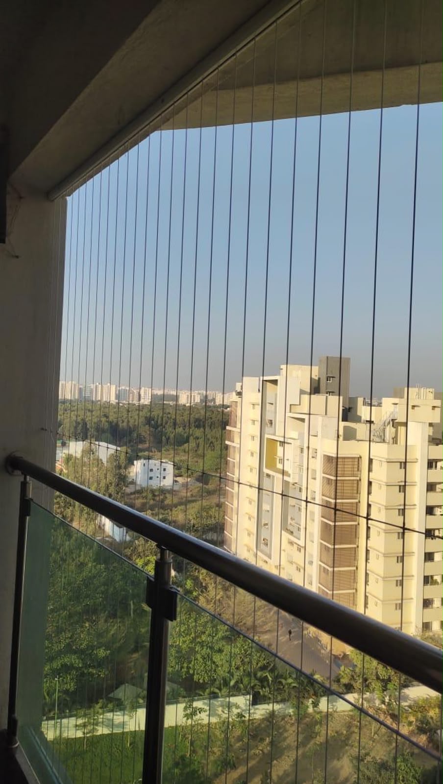 Invisible grille fitted to a high-rise apartment balcony